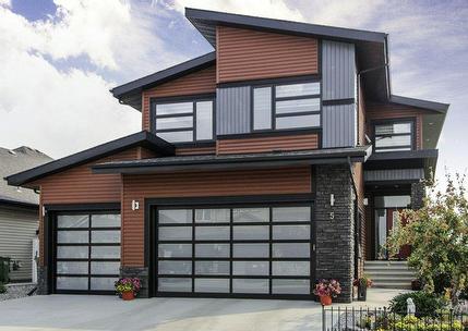 Modern house with triple garage backing onto a green space and pond in Vanier East.